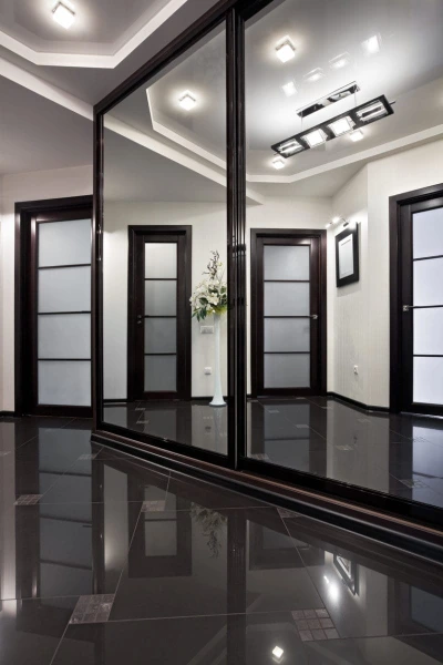 A spacious room featuring black floors and black walls.