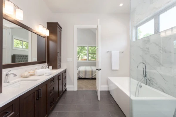 A spacious bathroom featuring a large walk-in shower alongside a modern bathtub.