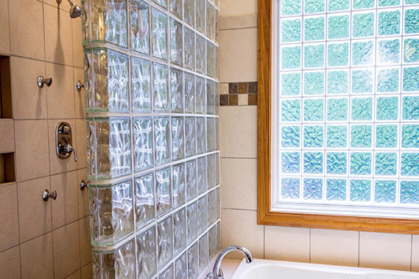 A bathroom featuring a bathtub and a window, providing natural light and a serene atmosphere.