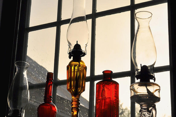 A collection of various glass bottles arranged together on a surface.