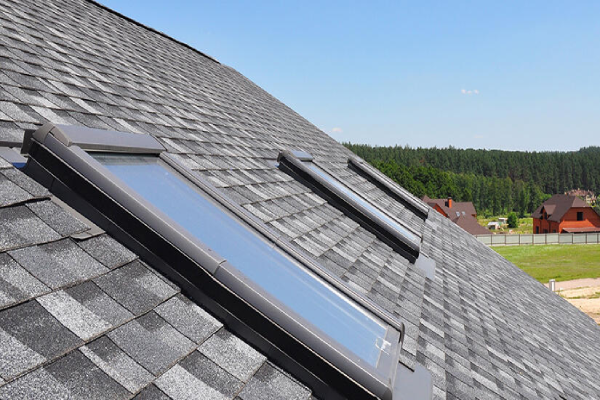 A roof featuring two skylights, allowing natural light to enter the space below.