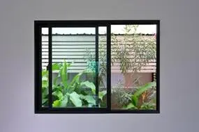a black sliding windows that open horizontally