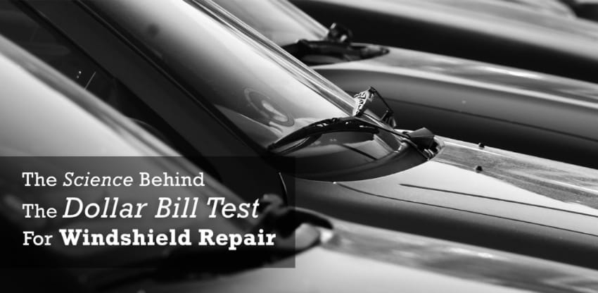 A side view of the windshield on four black cars